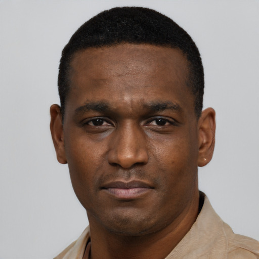 Neutral black young-adult male with short  black hair and brown eyes