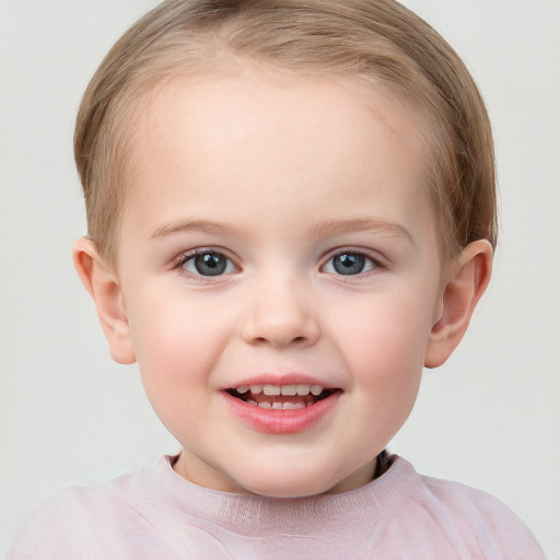 Joyful white child female with short  brown hair and blue eyes