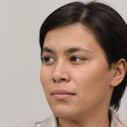 Neutral asian young-adult female with medium  brown hair and brown eyes
