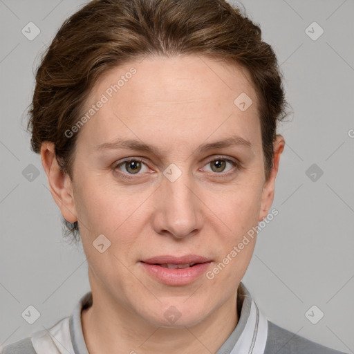 Joyful white adult female with short  brown hair and grey eyes