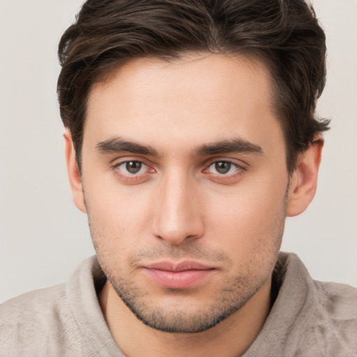 Neutral white young-adult male with short  brown hair and brown eyes