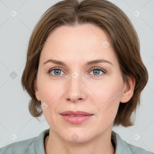 Joyful white young-adult female with medium  brown hair and blue eyes