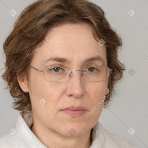 Joyful white adult female with medium  brown hair and green eyes