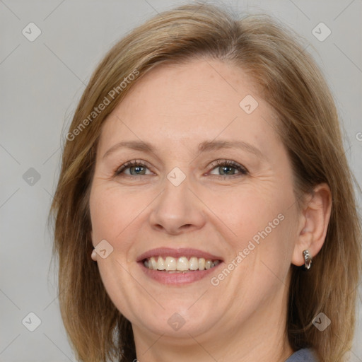 Joyful white adult female with medium  brown hair and grey eyes