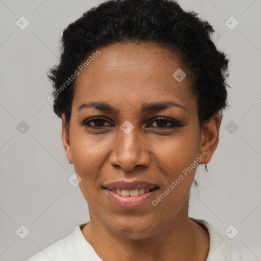 Joyful black adult female with short  black hair and brown eyes