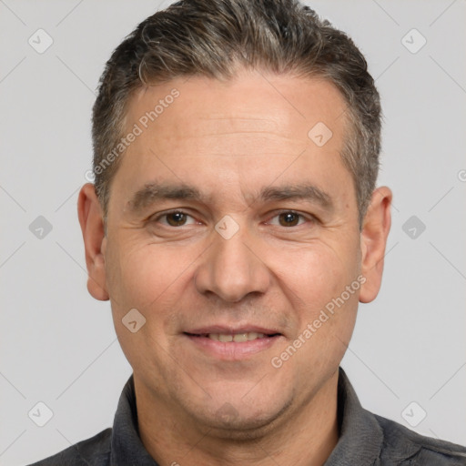 Joyful white adult male with short  brown hair and brown eyes