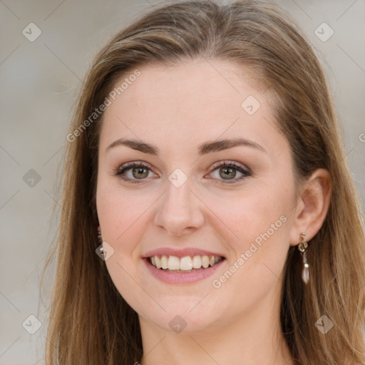 Joyful white young-adult female with long  brown hair and green eyes