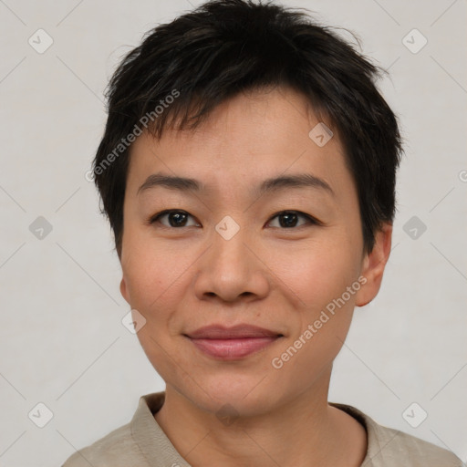 Joyful asian young-adult female with short  brown hair and brown eyes