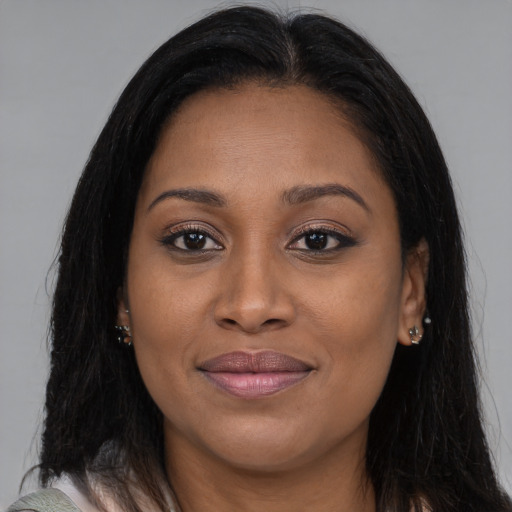 Joyful asian young-adult female with long  brown hair and brown eyes