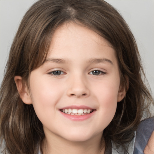 Joyful white child female with medium  brown hair and grey eyes