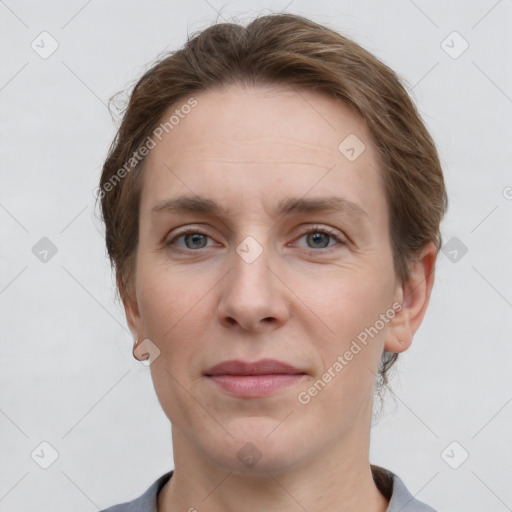 Joyful white adult female with short  brown hair and grey eyes