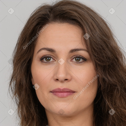 Joyful white adult female with long  brown hair and brown eyes