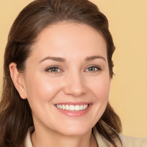 Joyful white young-adult female with medium  brown hair and brown eyes