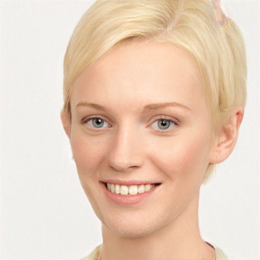 Joyful white young-adult female with short  brown hair and blue eyes