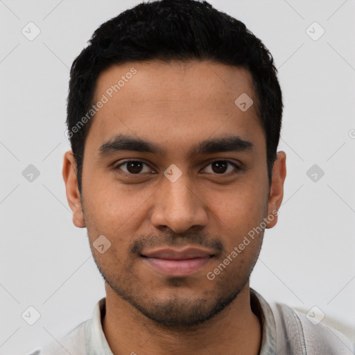 Joyful latino young-adult male with short  black hair and brown eyes