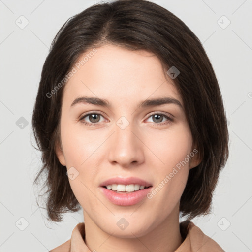 Joyful white young-adult female with medium  brown hair and brown eyes