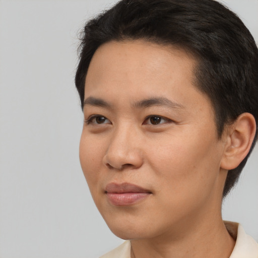 Joyful white young-adult female with short  black hair and brown eyes