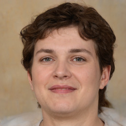 Joyful white young-adult male with medium  brown hair and brown eyes