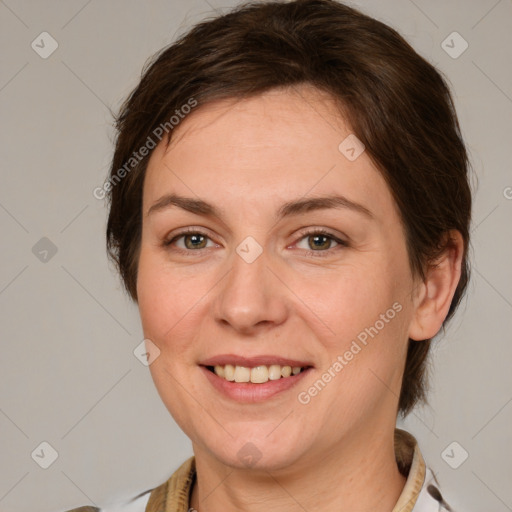 Joyful white adult female with medium  brown hair and grey eyes