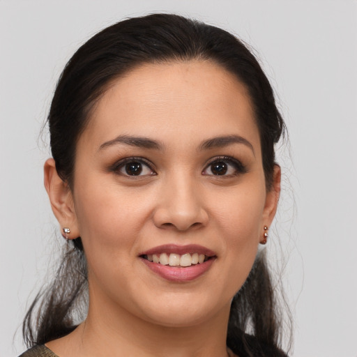 Joyful white young-adult female with medium  brown hair and brown eyes