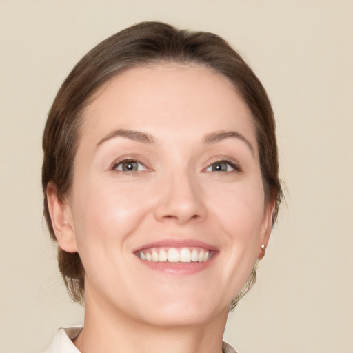 Joyful white young-adult female with medium  brown hair and brown eyes