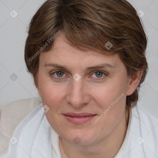 Joyful white adult female with medium  brown hair and blue eyes