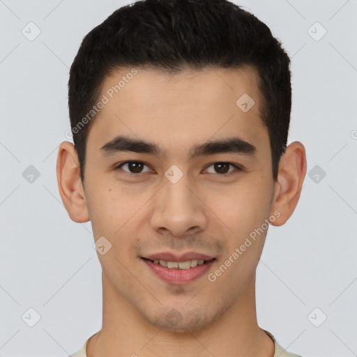 Joyful latino young-adult male with short  brown hair and brown eyes