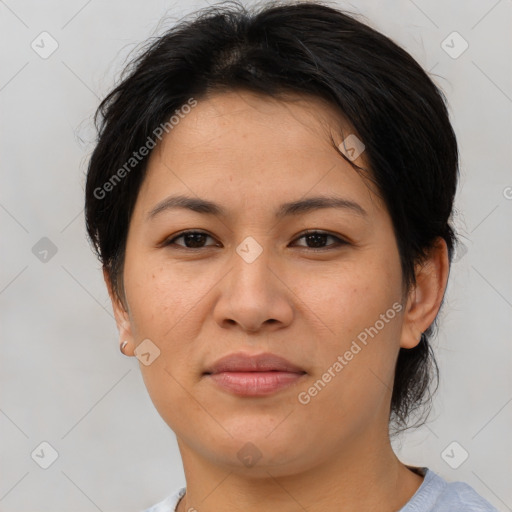 Joyful asian young-adult female with medium  brown hair and brown eyes