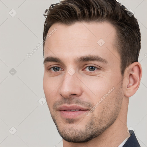 Joyful white young-adult male with short  brown hair and brown eyes