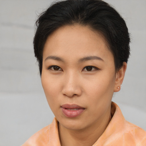 Neutral asian young-adult female with short  brown hair and brown eyes