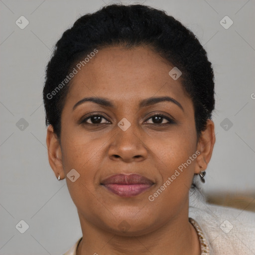 Joyful black adult female with short  brown hair and brown eyes