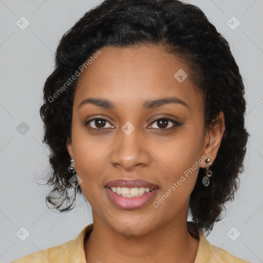 Joyful black young-adult female with long  black hair and brown eyes