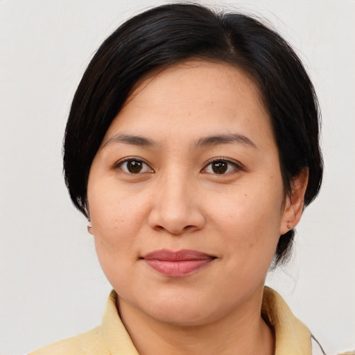 Joyful white young-adult female with medium  brown hair and brown eyes