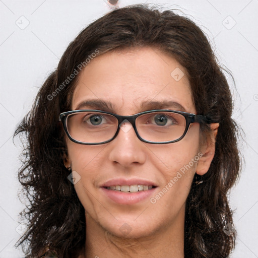 Joyful white young-adult female with long  brown hair and blue eyes