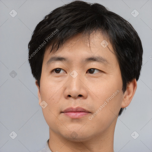 Neutral asian young-adult male with short  black hair and brown eyes