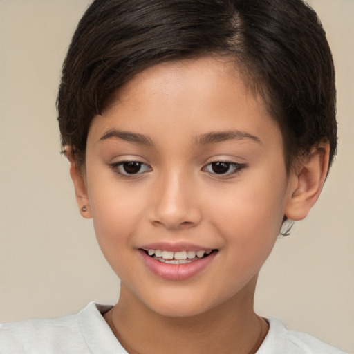 Joyful white child female with short  brown hair and brown eyes