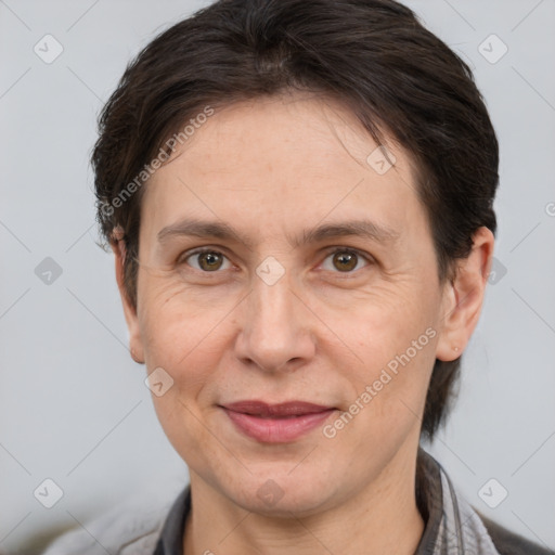 Joyful white adult female with short  brown hair and brown eyes