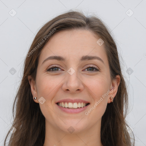 Joyful white young-adult female with long  brown hair and grey eyes