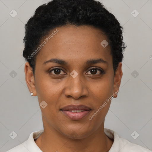 Joyful black young-adult female with short  black hair and brown eyes