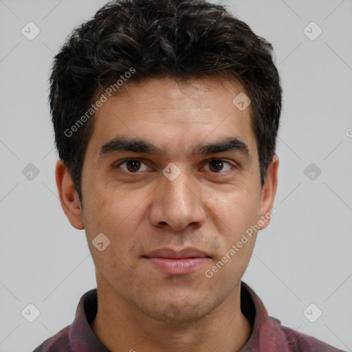 Joyful white adult male with short  black hair and brown eyes