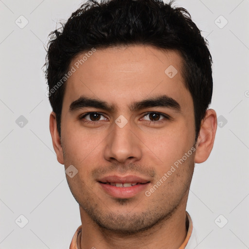 Joyful white young-adult male with short  black hair and brown eyes