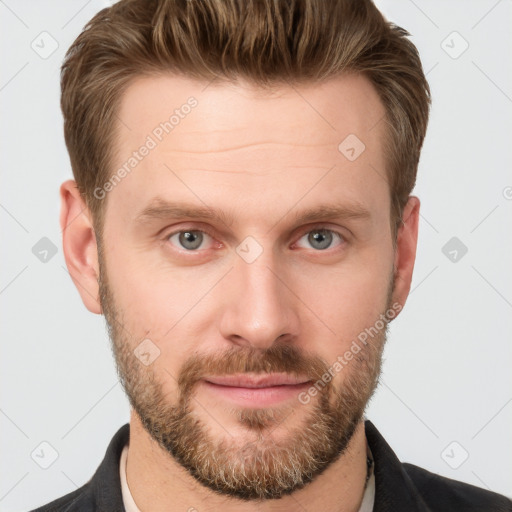 Joyful white young-adult male with short  brown hair and grey eyes