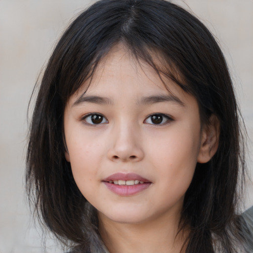Joyful asian child female with medium  brown hair and brown eyes