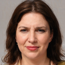 Joyful white adult female with medium  brown hair and brown eyes