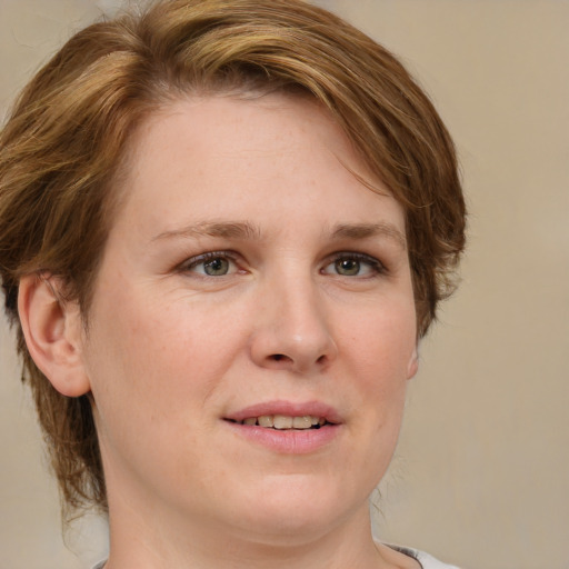 Joyful white young-adult female with medium  brown hair and blue eyes