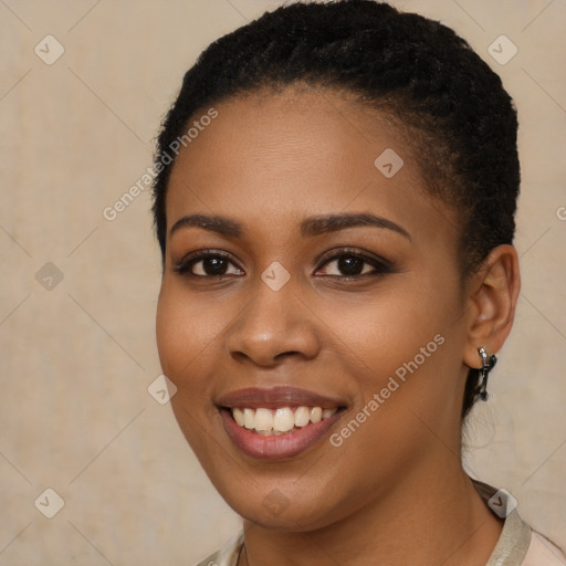 Joyful black young-adult female with short  brown hair and brown eyes