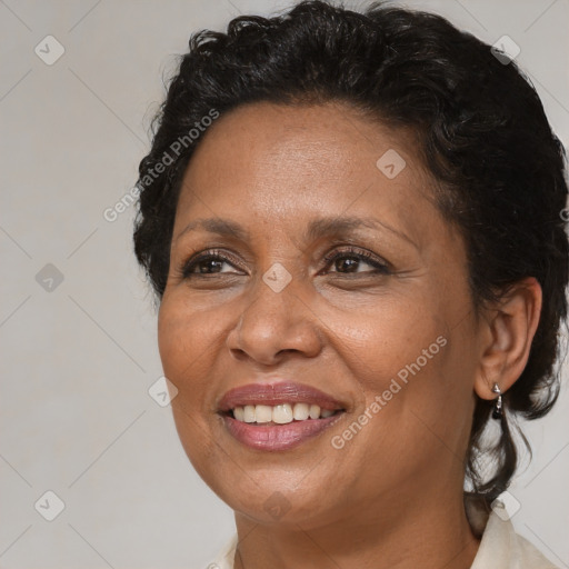 Joyful black adult female with short  brown hair and brown eyes