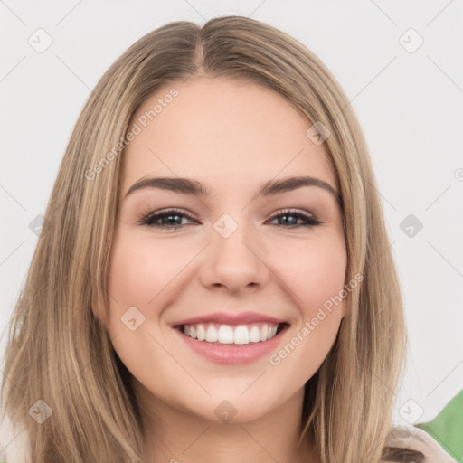 Joyful white young-adult female with long  brown hair and brown eyes