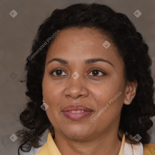 Joyful black adult female with medium  brown hair and brown eyes