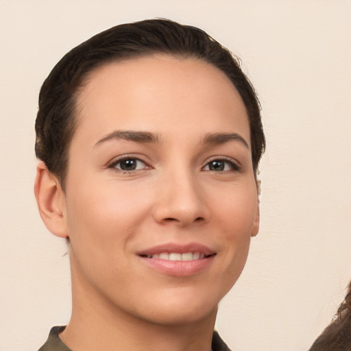 Joyful white young-adult female with short  brown hair and brown eyes